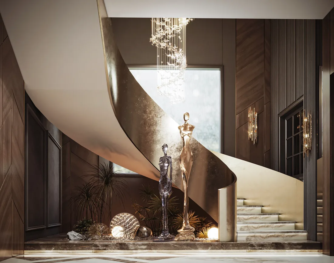 Sculptural bronze staircase rising past a crystal chandelier